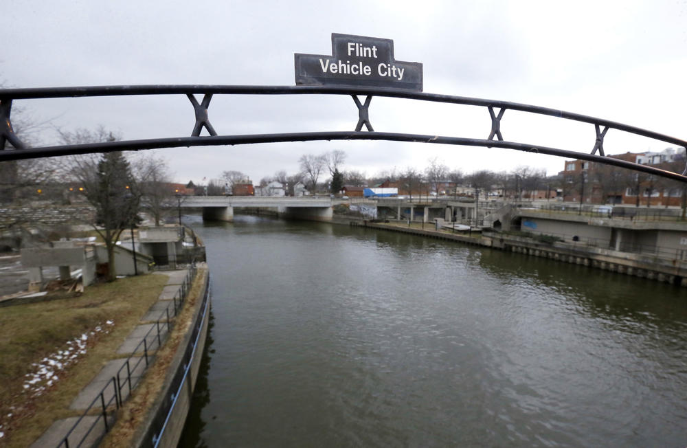 A sign over the Flint River in 2016. Nationwide, the number of lead and galvanized pipes that need to be replaced is estimated between 8 and 10 million.