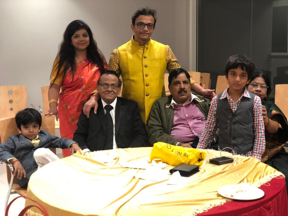 Richa Srivastava (rear left) with her husband, Shalabh Pradhan (rear right), and their two fathers, Sudheer Kumar Pradhan (front left) and Sheo Prakash Srivastava (front right), in an undated family photo. The two family patriarchs died within three days of one another in April.