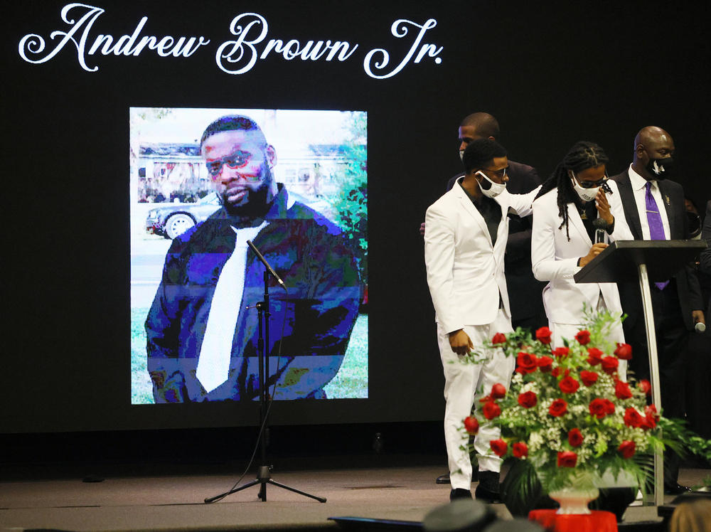 Brown's sons — Jha'rod Ferebee (left) and Khalil Ferebee — speak at his funeral this month in Elizabeth City, N.C. Pasquotank County deputies shot Brown to death on April 21.