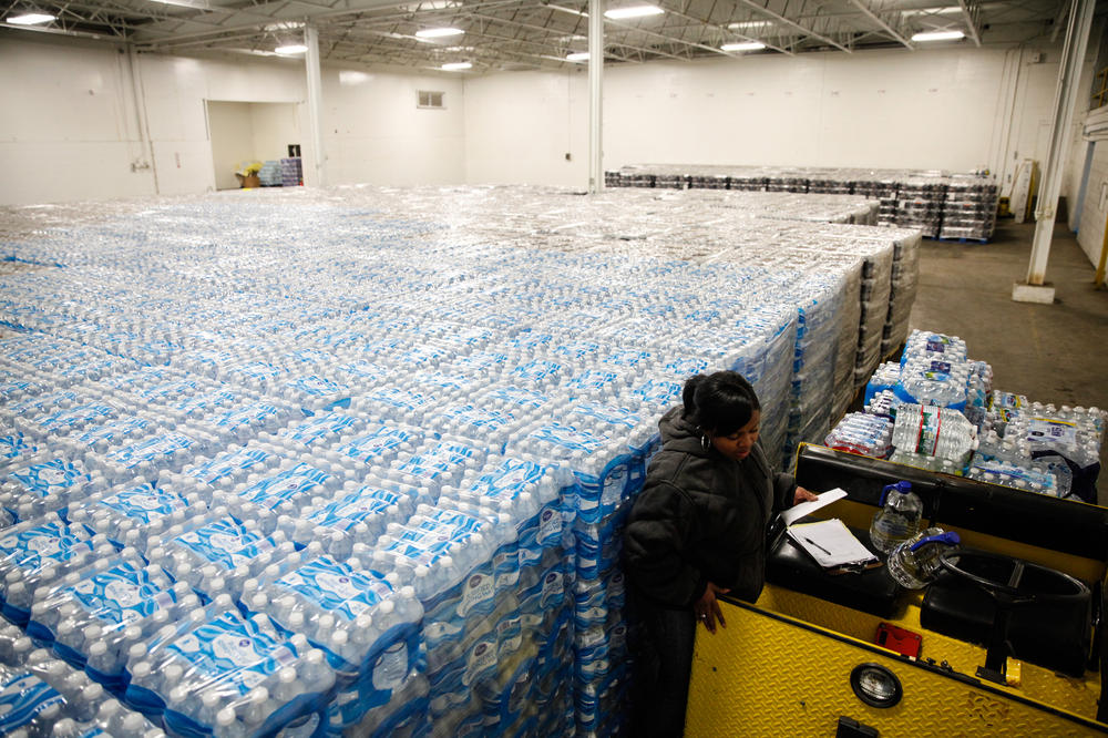 Pallets of bottled water await distribution in a warehouse in Flint, Mich., in 2016. The warehouse was the emergency water supply for residents affected by the lead crisis that began in 2014.