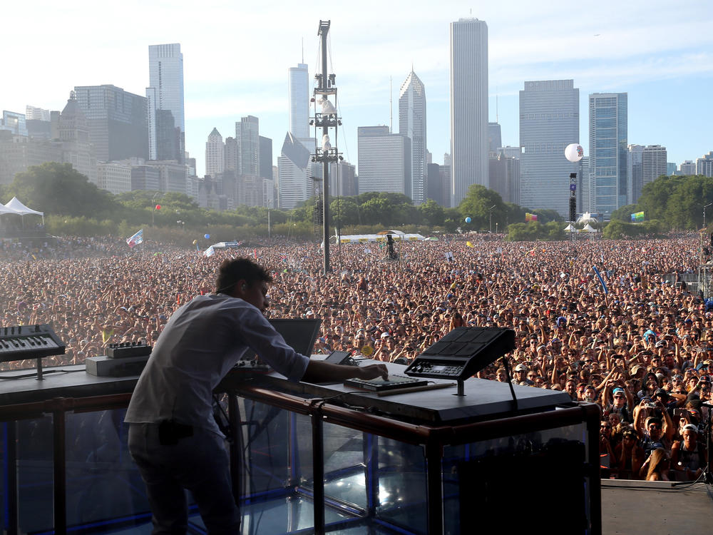 Electronic artist Flume performs at Lollapalooza in 2016. The festival is set to return at full capacity this summer.