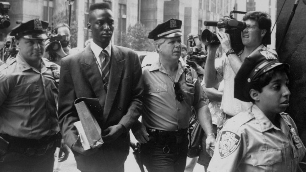 Yusef Salaam is seen being escorted by police in 1990 in this archival photo.