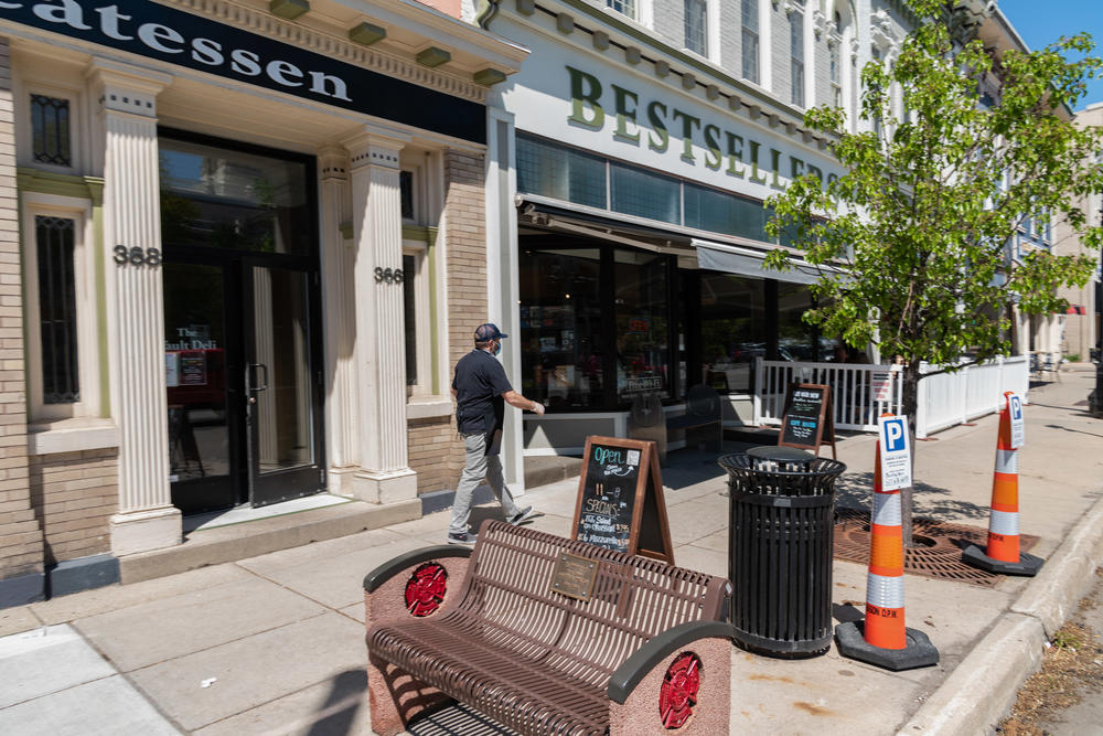 Mason residents enjoy a warm afternoon. The city has been slowly replacing old pipes during routine roadwork.