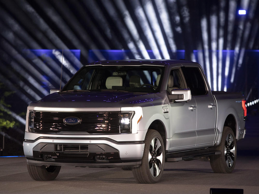 Ford unveils its new all-electric F-150 Lightning pickup Wednesday at Ford World Headquarters in Dearborn, Mich. The truck will come with a price tag that starts at just under $40,000.