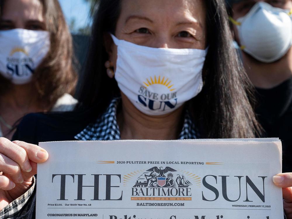 <em>Baltimore Sun</em> reporter Jean Marbella participates in a Save Our Sun rally in March, part of an effort to secure an alternative buyer to Alden Global Capital.