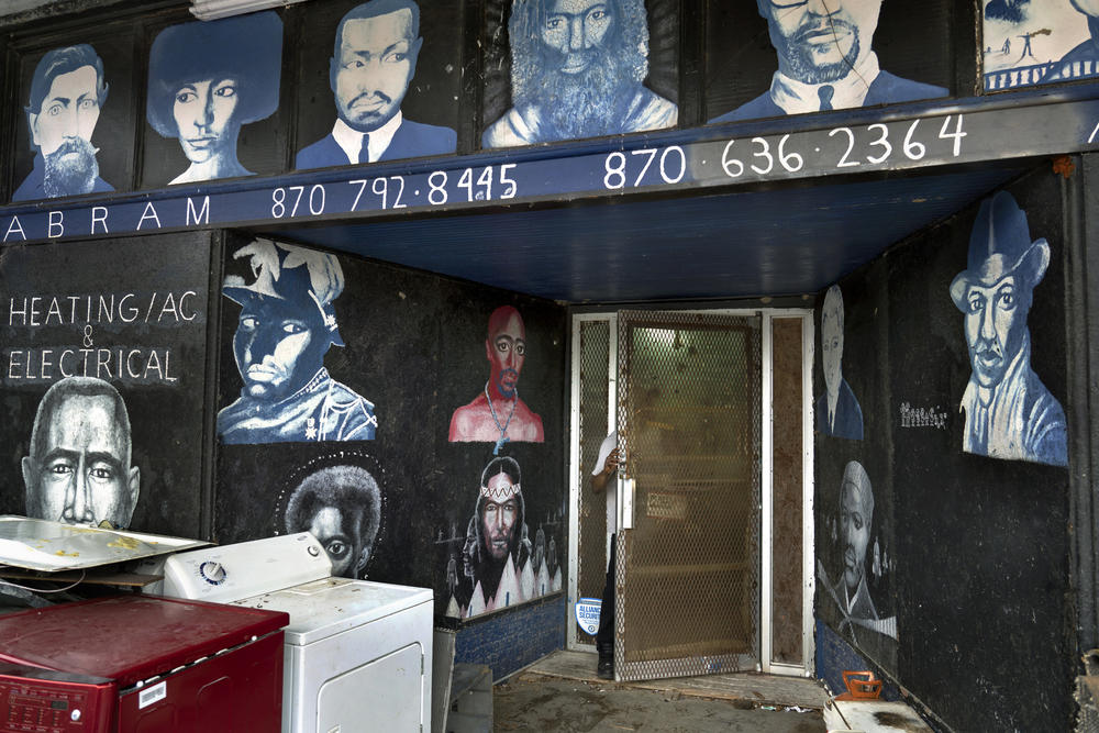 Stacy Abram's appliance store with portraits painted by Timothy Way. 