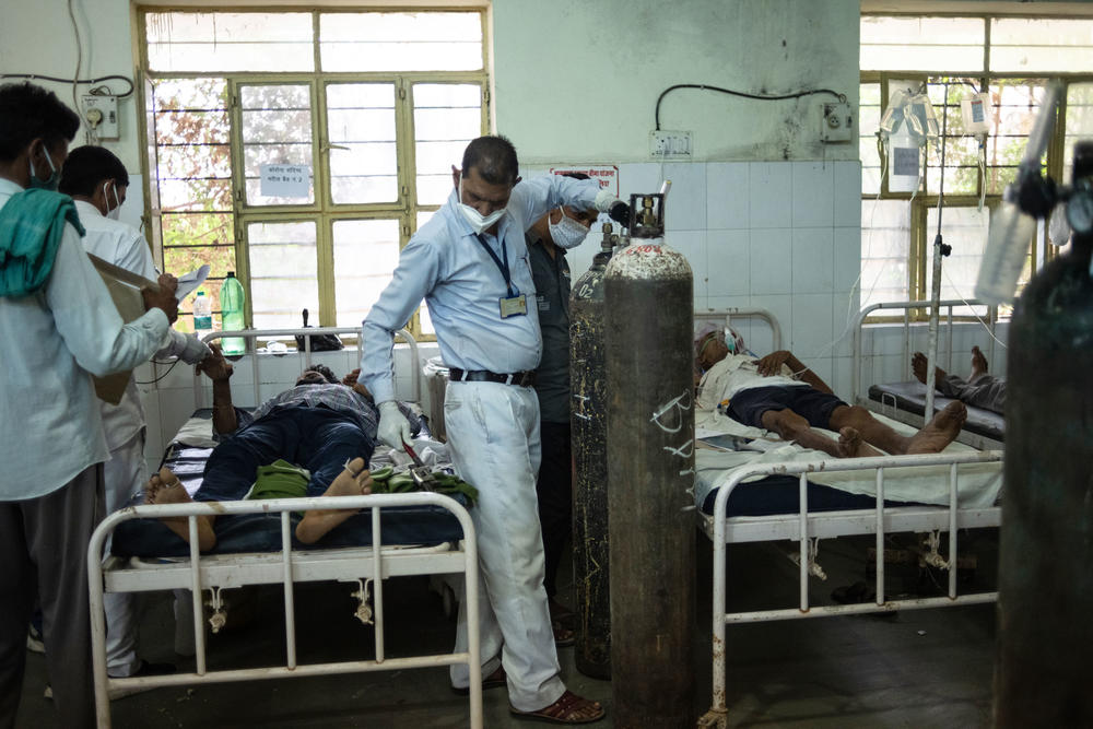 Medical attendant Gurmesh Kumawat prepares to administer supplemental oxygen to a coronavirus patient in the emergency ward at the BDM Government Hospital last week in Kotputli, Jaipur District, Rajasthan, India.