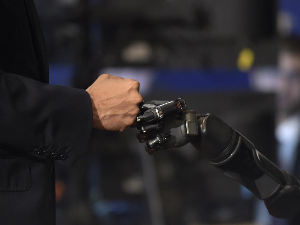 President Barack Obama bumped fists with Nathan Copeland during a tour of innovation projects at the White House Frontiers Conference at the University of Pittsburgh in 2016.