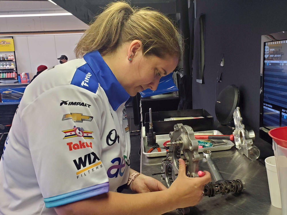 Mechanic Anna Chatten works on a spare gearbox for her team, Dreyer & Reinbold. 