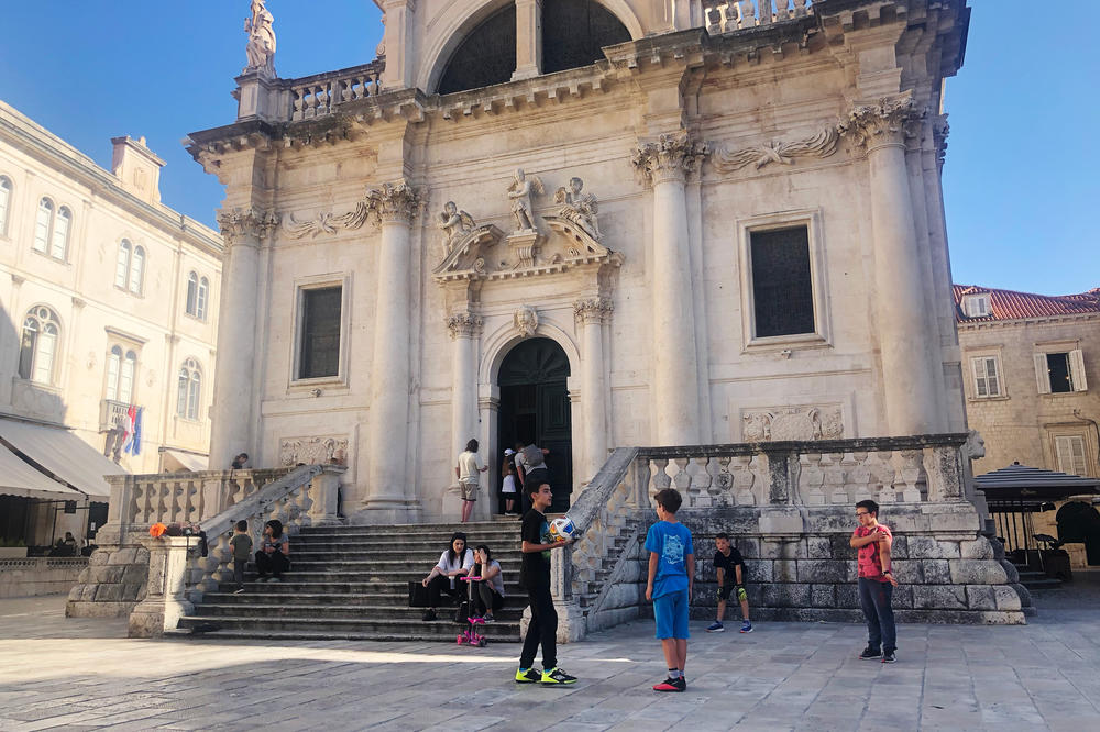 As the city suffers its worst tourism year on record, Dubrovnik has returned to its residents, like these young boys who play a pickup game of soccer outside the Church of Saint Blaise in what's typically one of the busiest squares in the old town.