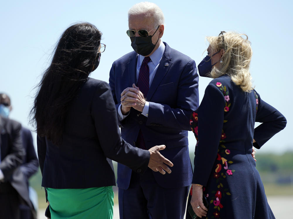 President Biden speaks with Reps. Rashida Tlaib (left) and Debbie Dingell on Tuesday after arriving in Detroit. Tlaib, a progressive Democrat and the first Palestinian American woman in Congress, expressed her opposition toward U.S. policy with Israel to Biden.
