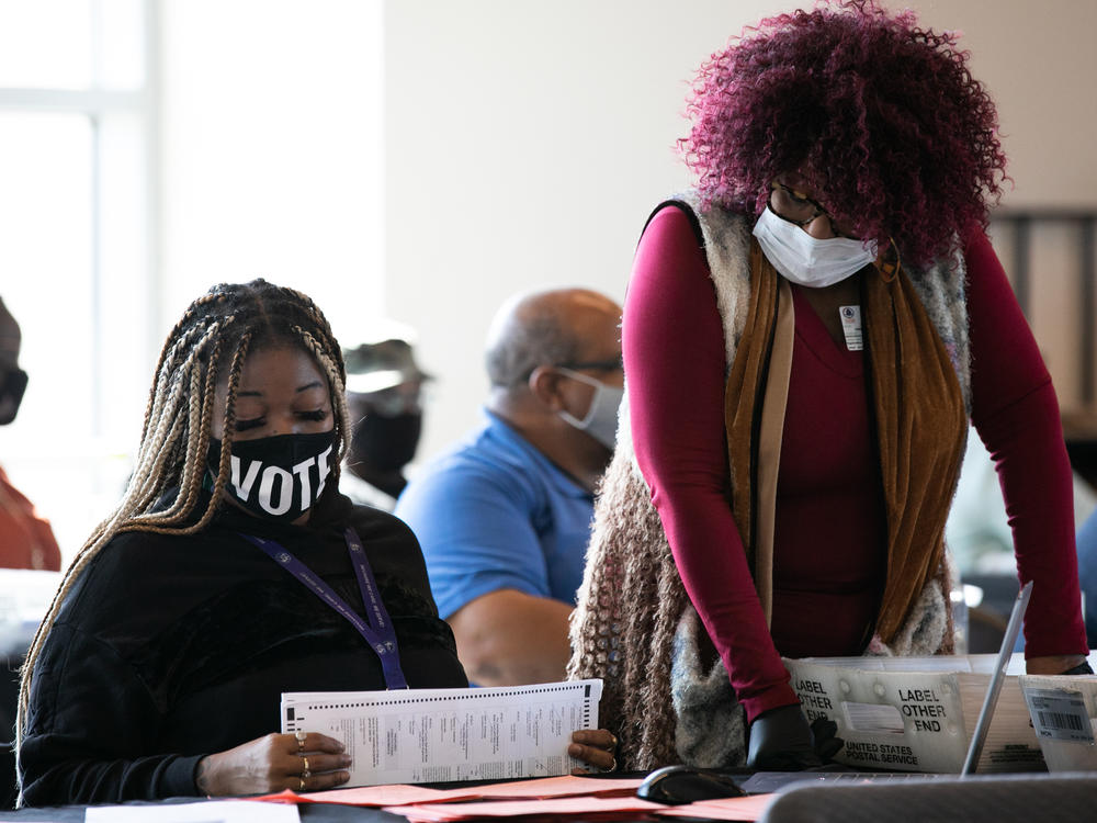 Fulton County workers count absentee ballots on Nov. 6, 2020, in Atlanta. A judge's order marks the latest challenge for the county in a seemingly never-ending election cycle.