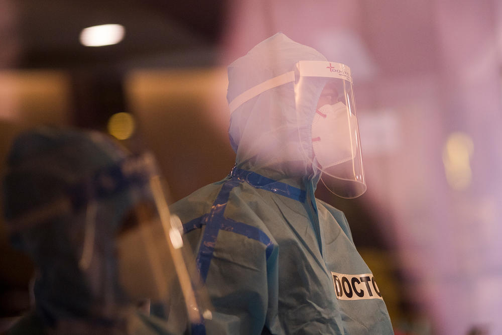 A doctor is seen at a facility for COVID-19 patients in April when a New Delhi banquet hall was converted into an isolation center to handle rising cases of infection.