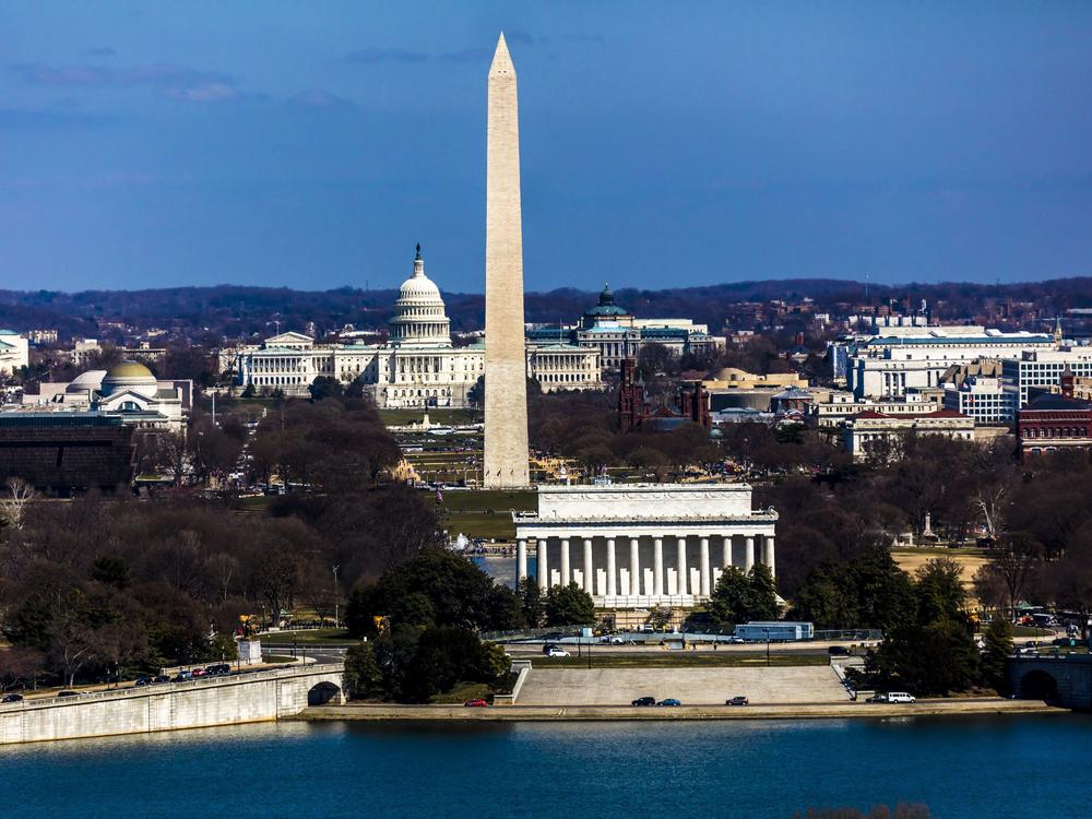 An aerial view of Washington, D.C., shows the Lincoln Memorial and Washington Monument as well as the U.S. Capitol.