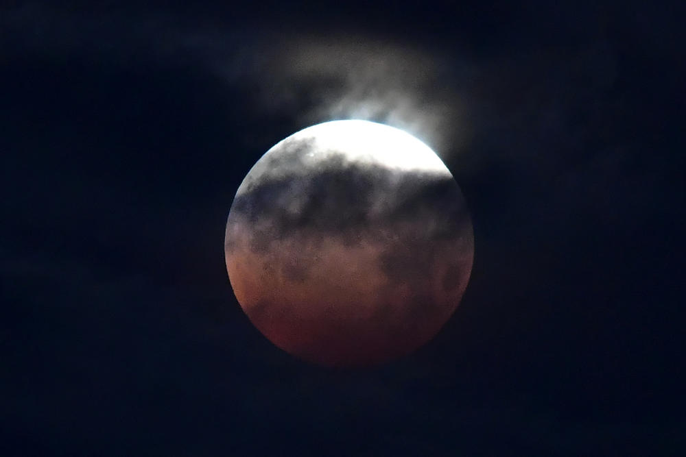 The lunar eclipse is seen in Santa Monica. Full moons that occur in May are sometimes known as flower moons.