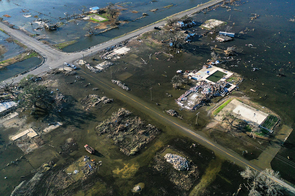 An aerial view of flood waters from Hurricane Delta surrounding structures destroyed by Hurricane Laura on October 10, 2020 in Creole, Louisiana. Hurricane Delta made landfall as a Category 2 storm in Louisiana initially leaving some 300,000 customers without power.