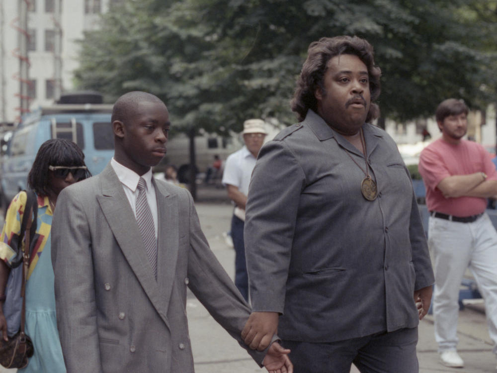 Salaam appears with Rev. Al Sharpton during his 1990 trial.
