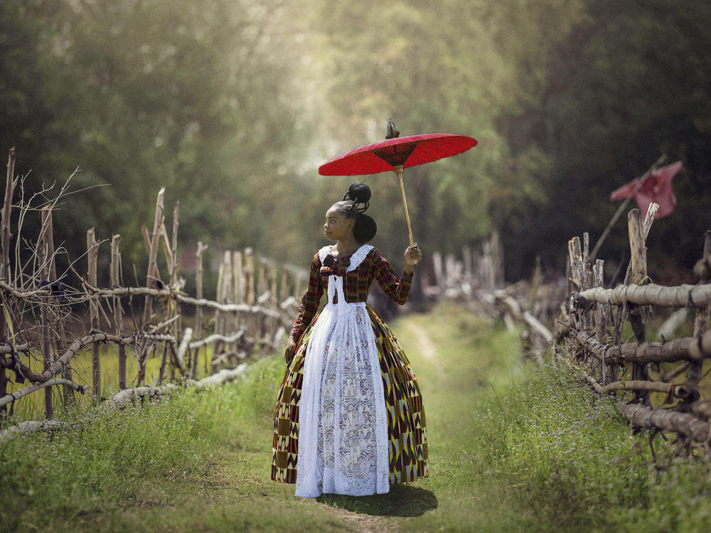 In<em> Voyages of an African Victorian, </em>a woman wears a Victorian-style dress made of African fabrics.