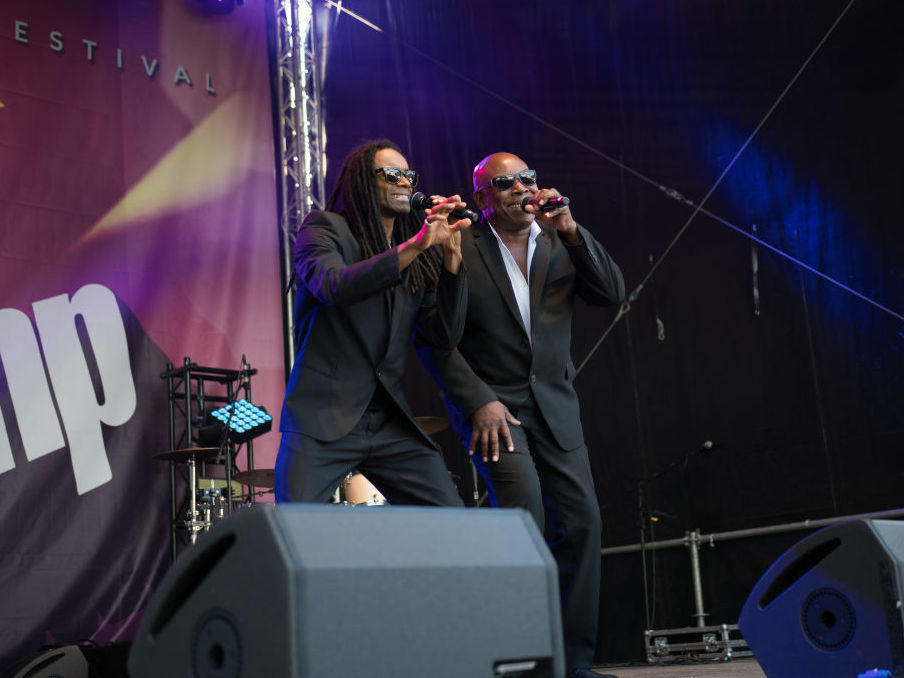 John Davis (right), onstage with former Milli Vanilli star Fabrice 