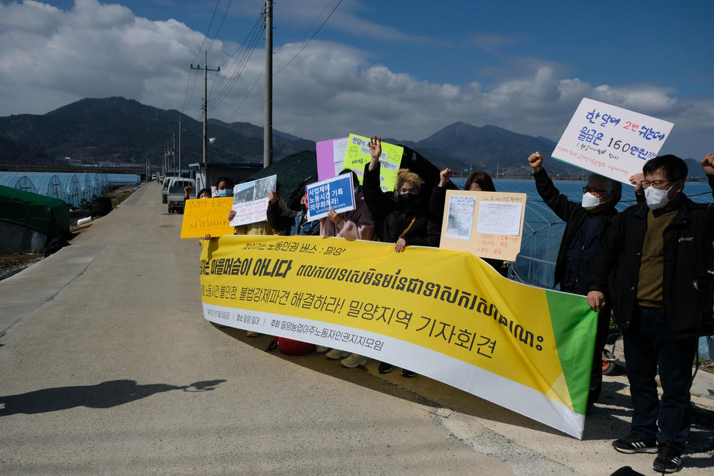 Carrying a banner with the message 