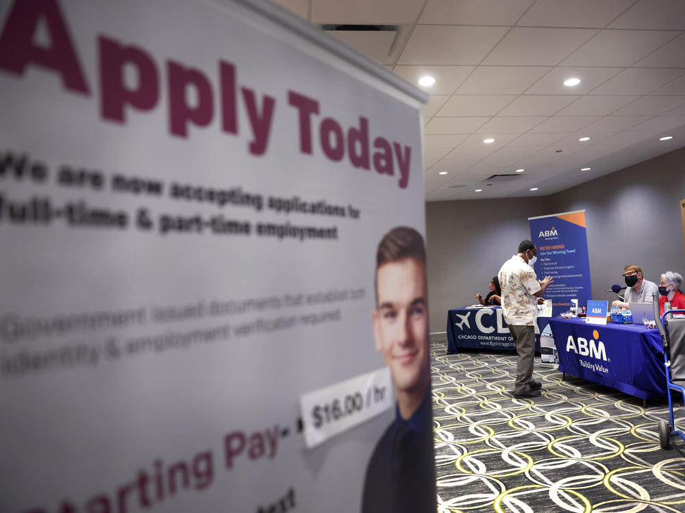 Recruiters looking to fill positions at O'Hare International Airport meet with candidates during a job fair at the Chicago airport on May 19. Hiring was expected to have picked up last month, providing a shot of relief to an economy in need of workers as businesses start to reopen again.