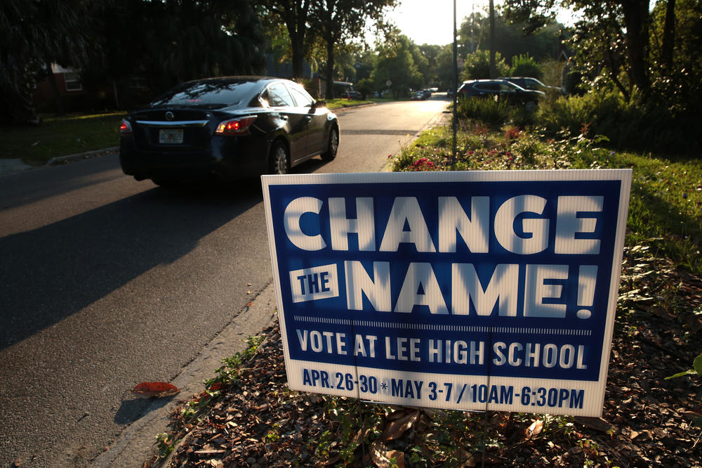 A sign in a yard close to Robert E. Lee High School calls for changing the school's name. The signs could be seen scattered throughout the neighborhoods surrounding the school.