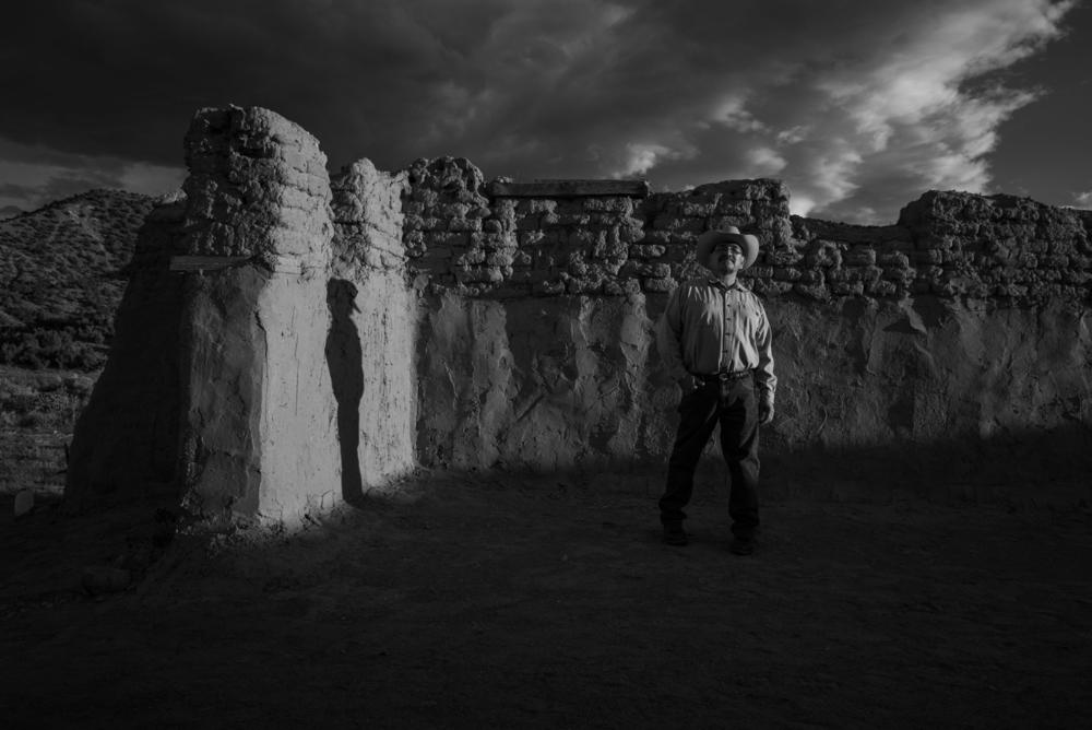 Photographer Russel Albert Daniels (Diné & Ho-Chunk) is based in Salt Lake City. His projects explore identity, memory and history. In this photo, Delvin Garcia stands in the remains of an 18th century Catholic church in New Mexico. Garcia is a descendent of a Genízaro family from Abiquiú, N.M. Genízaro was a Spanish imperial caste of Indigenous enslaved people in the Southwest borderlands.