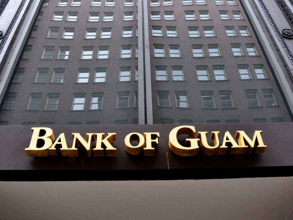 Dozens of people in Micronesia are suing the Bank of Guam for seizing stimulus checks they deposited. The bank did so to help the IRS recover tax payments issued in error.