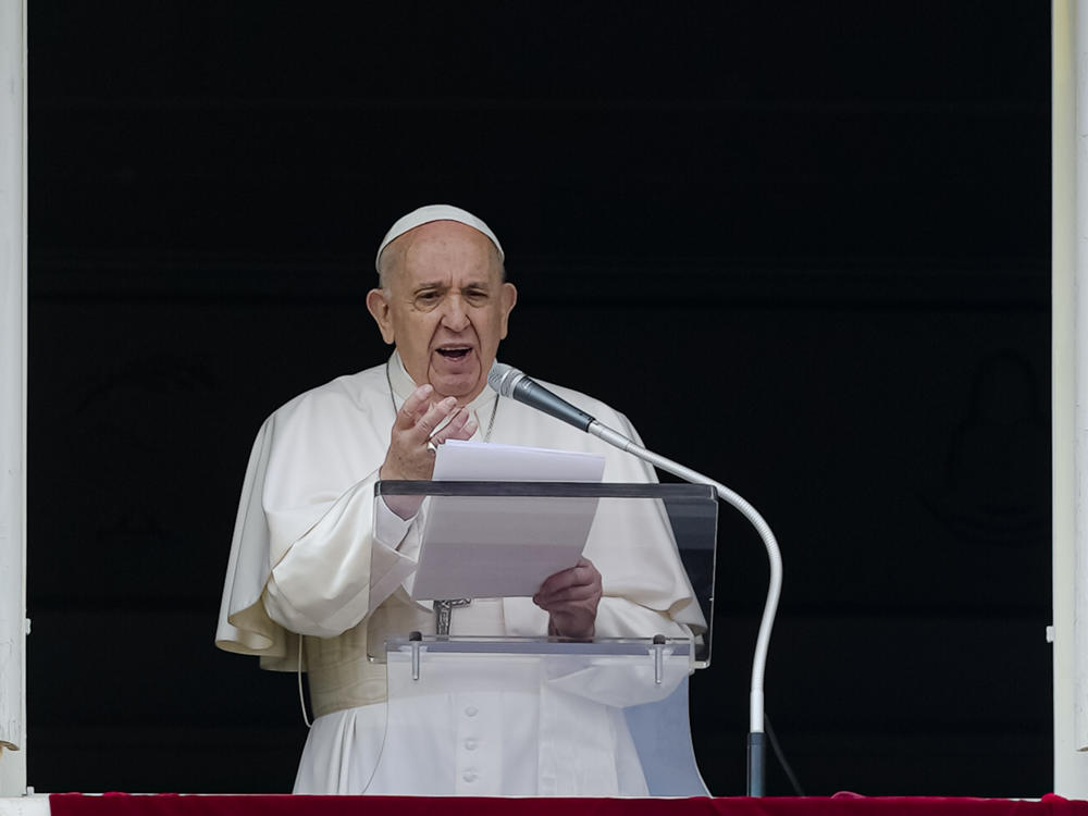 Pope Francis speaks from the window of his studio overlooking St. Peter's Square on Sunday. Francis expressed sorrow for the treatment of Indigenous people in Canada, but did not offer an apology.