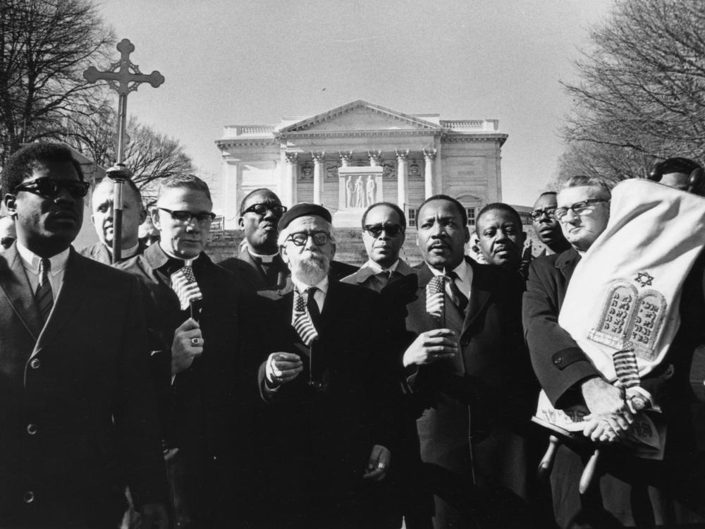 Rabbi Abraham Heschel (center) and Martin Luther King Jr. stand with (from left) Bishop James Shannon and Rabbi Maurice Eisendrath during a protest at the Tomb of the Unknown Soldier in Arlington National Cemetery on Feb. 6, 1968.