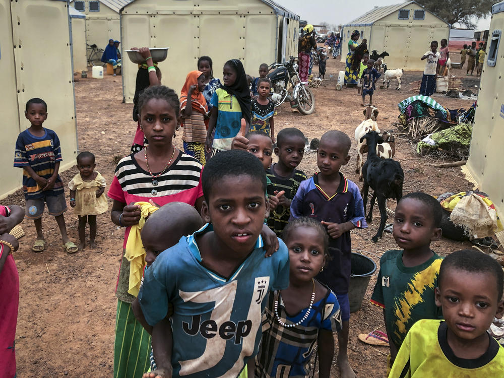 Children of about 6,000 ethnic Fulanis who have been displaced by attacks gather in a makeshift camp in Youba, Burkina Faso, in April 2020. The West African nation continues to be racked by violence linked to Islamic extremists and local defense militias.