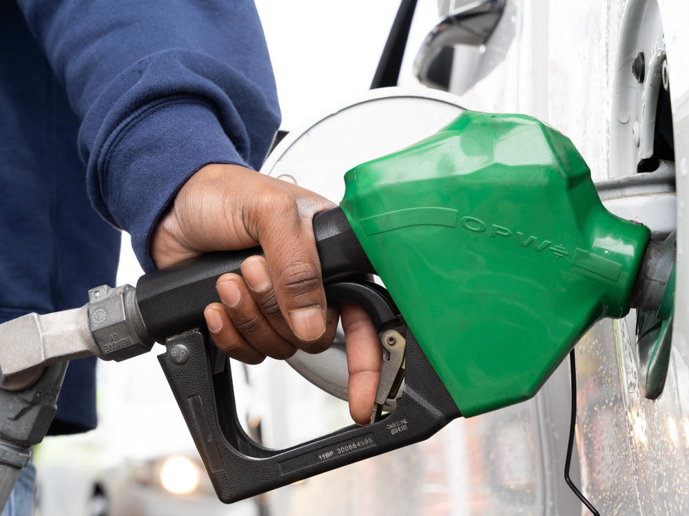 A man refuels at a gas station last month in Fayetteville, N.C., during a period when a hacking attack shut down a key pipeline. Oil companies confront an uncertain future, facing pressure to move toward greener energy.