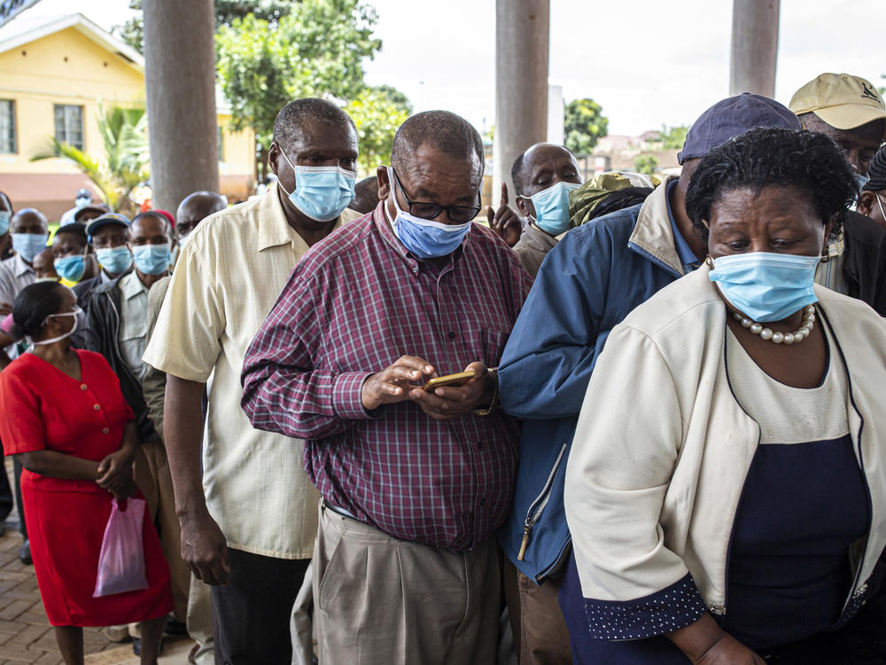 Vaccine doses are in short supply in African countries — and even when they arrive, there may not be a way to get them into people's arms in a timely fashion. Above: People wait to get vaccinated at a hospital in Thika, Kenya, in March.