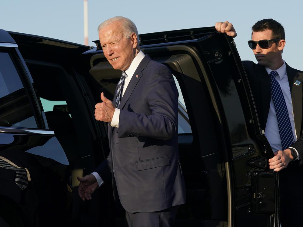President Biden steps into a motorcade vehicle after arriving Wednesday at Royal Air Force Mildenhall in Suffolk, England, on the first leg of his European trip. 