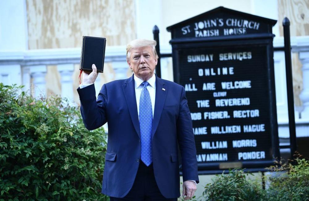 Then-President Donald Trump holds up a Bible in front of St. John's Church after walking across Lafayette Park from the White House on June 1, 2020.