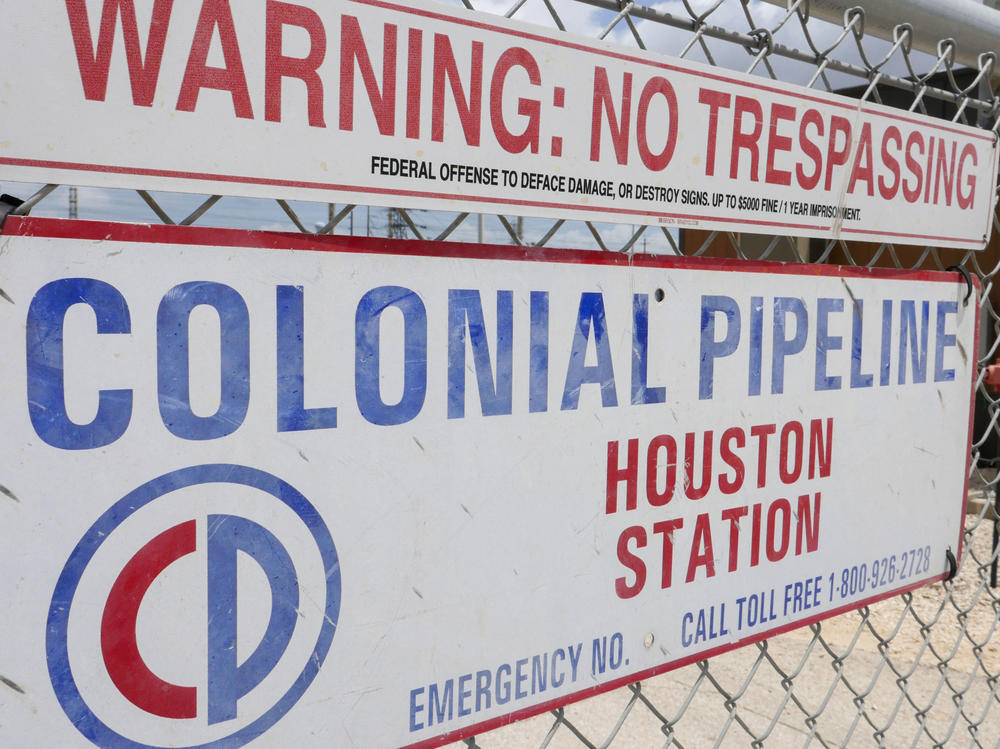 A sign at the Colonial Pipeline Houston Station facility in Pasadena, Texas, warns against trespassing. Colonial was forced to shut down a key pipeline last month after suffering a ransomware attack. Such attacks are becoming more frequent and increasingly, they are targeting key infrastructure like fuel or food supplies.