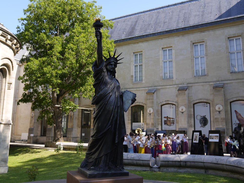 A mini replica of the French-designed Statue of Liberty will reach the U.S. on July 1. Here, the statue awaits its move in Paris on Monday.