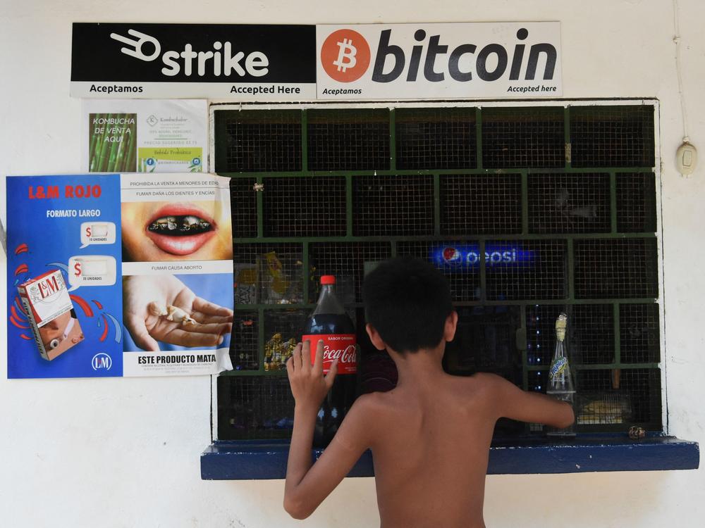 A sign at a store in El Zonte, El Salvador, advertises that it accepts bitcoins for payment.