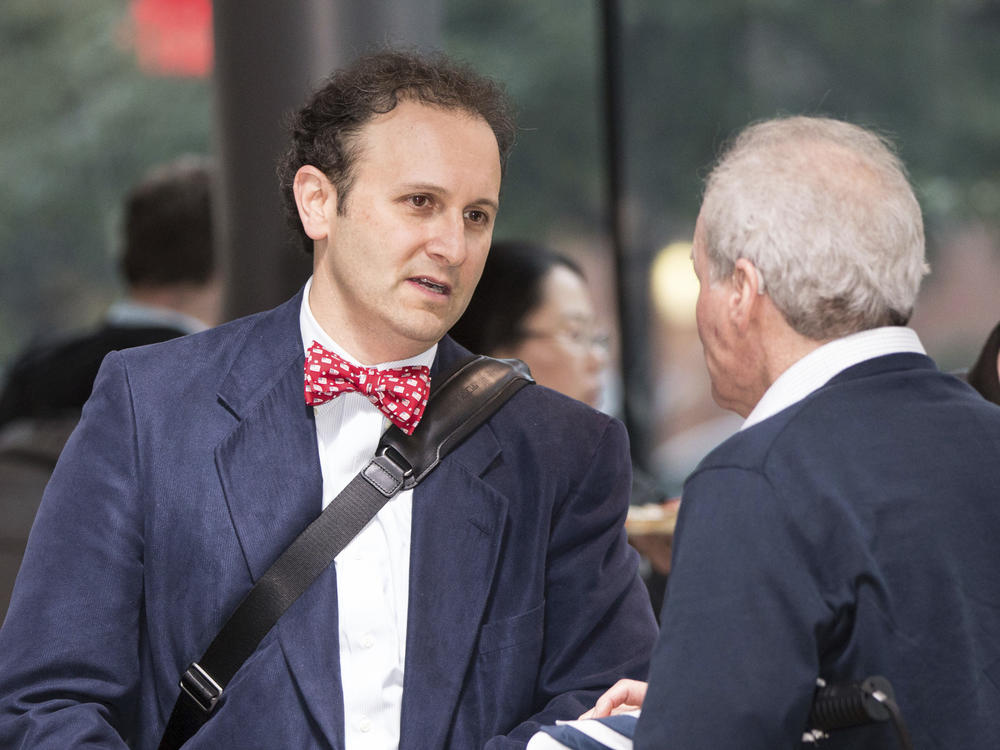 Dr. Aaron Kesselheim (left), a professor at Harvard Medical School, at a documentary film screening in 2018 in Boston. He has resigned from a Food and Drug Administration advisory panel over the FDA's decision to approve an Alzheimer's drug.