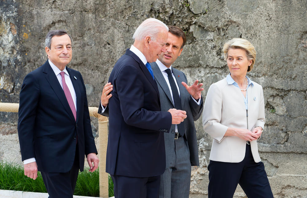 Italian Prime Minister Mario Draghi (from left), President  Biden, French President Emmanuel Macron and European Commission President Ursula von der Leyen speak during the leaders' official welcome Friday.