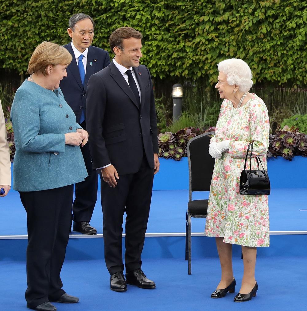 Queen Elizabeth II with Germany's Angela Merkel, Japan's Yoshihide Suga and France's Emmanuel Macron at a reception Friday. The British monarch joined the G-7 leaders for dinner. 
