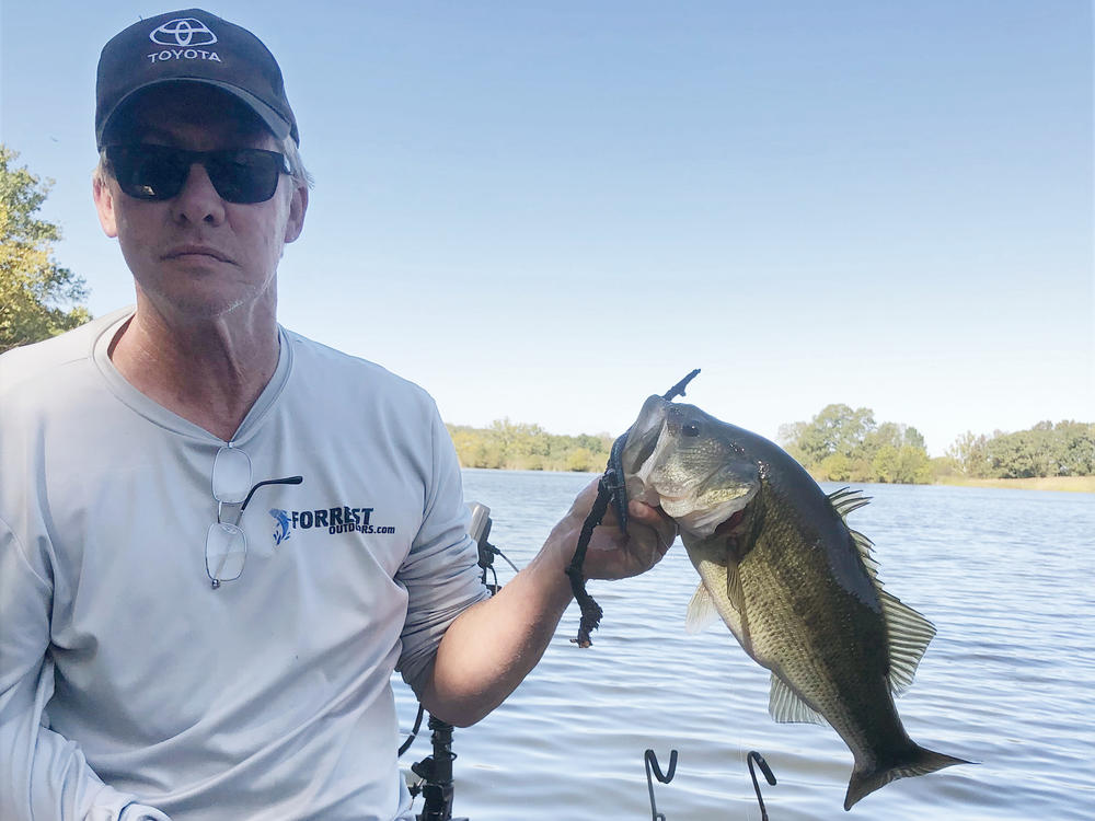 Mark Forrest is back fishing after rehabilitation with the IpsiHand device helped him regain use of his right hand.