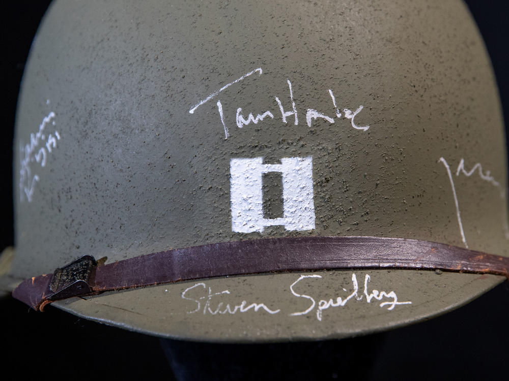 A cast-autographed helmet belonging to the character Hanks played in the 1998 World War II drama <em>Saving Private Ryan.</em>