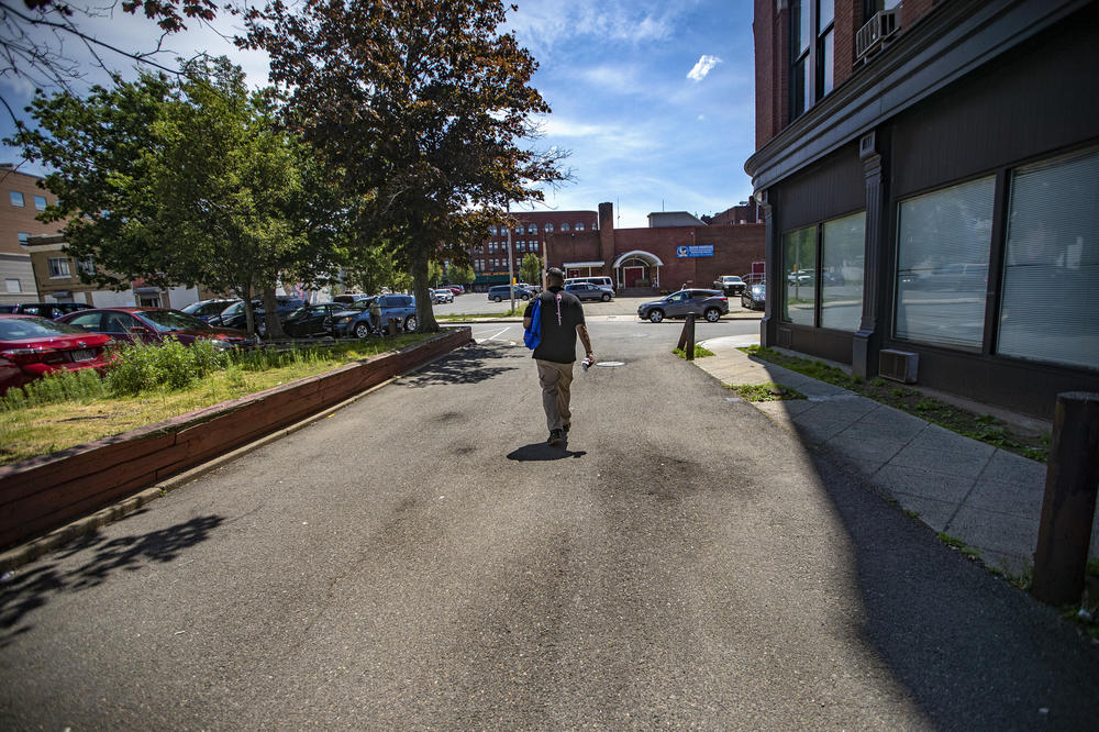 Will walks down an alleyway in Union Square in Lynn, Mass., searching for drug users. He distributes sterile syringes, Narcan and safety kits to keep them safe from the risks associated with drug use.