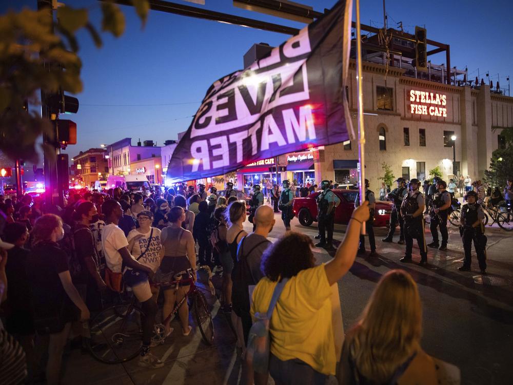 Protesters face police on June 6 in Minneapolis as they demand justice for Winston Boogie Smith Jr., who was fatally shot by members of a U.S. Marshals Fugitive Task Force. A woman at another Smith protest was killed Sunday after a vehicle drove into demonstrators.