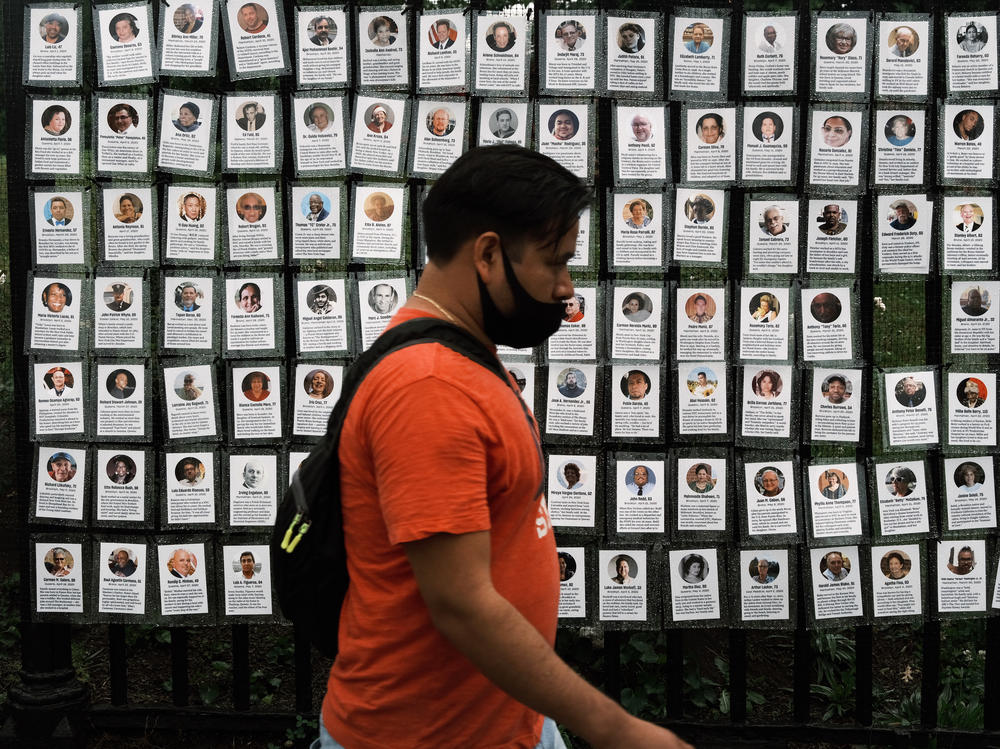 Memorials hang from the front gate of Greenwood Cemetery in New York City during an event organized by Naming the Lost Memorials to remember and celebrate those who died during the COVID-19 pandemic.