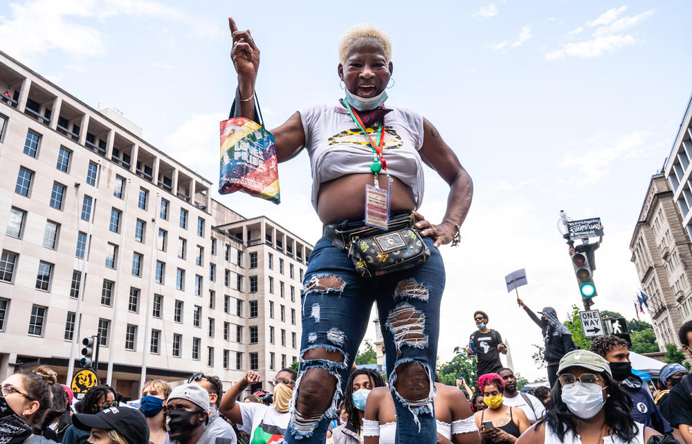 A person enjoys the music by Sugar Bear & EU on Black Lives Matter Plaza in Washington, D.C., on Juneteenth 2020.