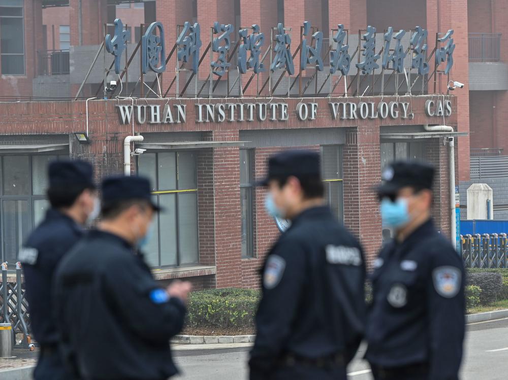 Security personnel stand guard outside the Wuhan Institute of Virology during the Feb. 3 visit of the World Health Organization team investigating the origins of the SARS-CoV-2, the virus that triggered a pandemic.