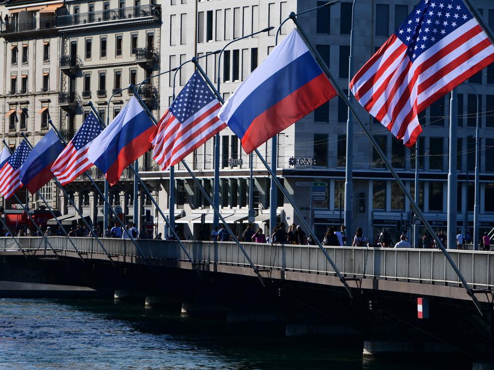 U.S. and Russian flags fly on the Mont-Blanc bridge on the eve of a US-Russia summit on Tuesday in Geneva. A former intelligence operative says agencies are in high gear.