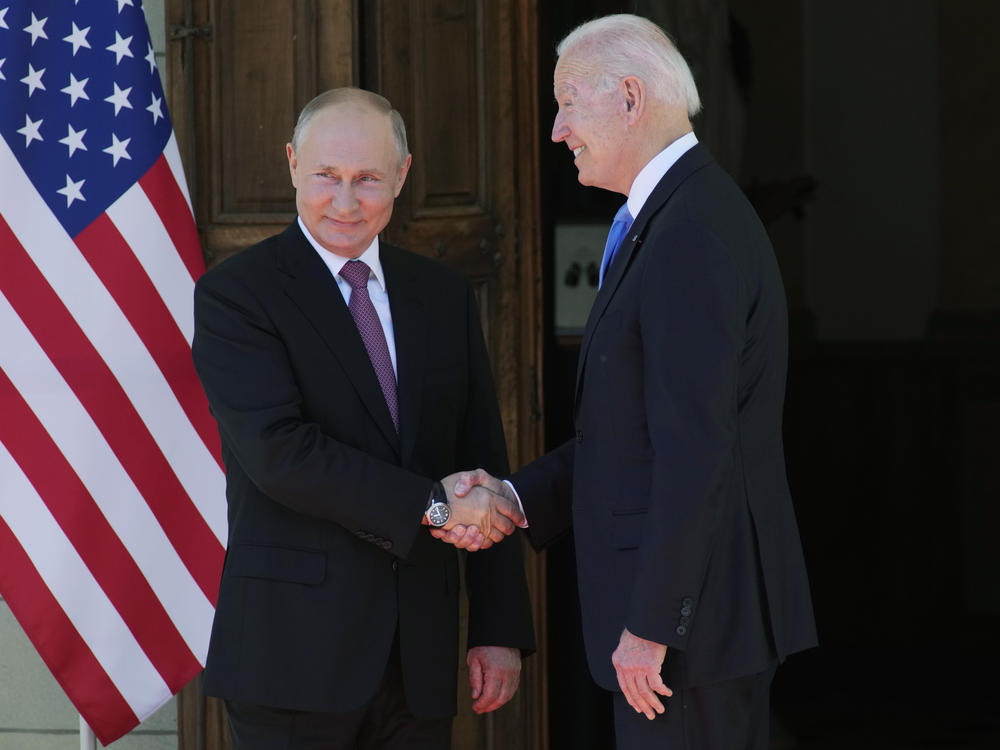 Russian President Vladimir Putin and President Biden shake hands during their meeting at the Villa la Grange in Geneva on Wednesday.